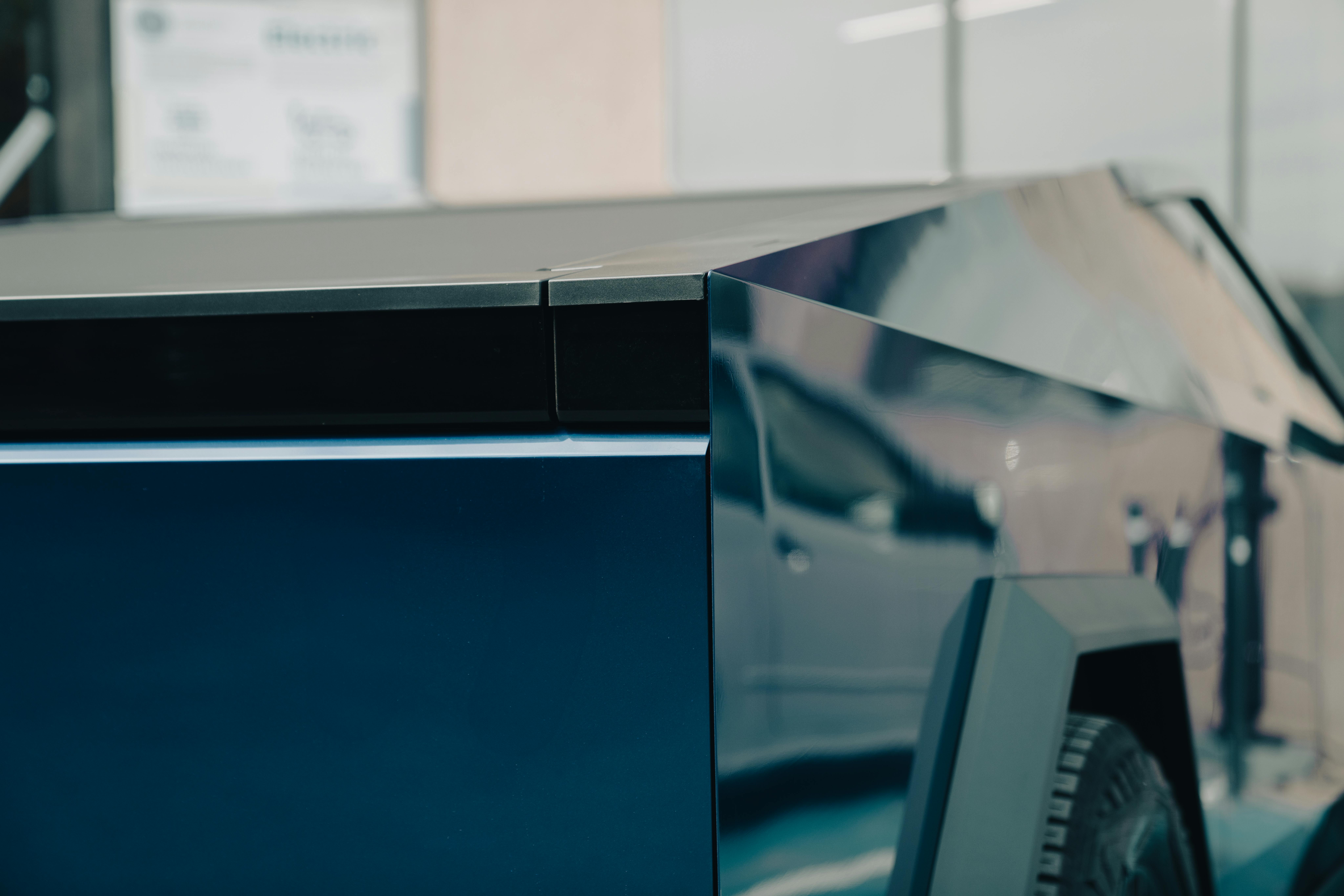 Close-up of angular stainless steel vehicle bodywork